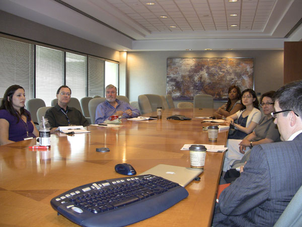 people working as a group around a table